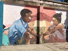04B Mural of two children studying inside the abandoned warehouse, the home of Paint Jamaica street art in Kingston Jamaica